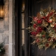 Christmas wreath trends 2027 featuring a red berry and gold leaf wreath