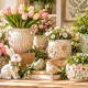 Wholesale spring home accessories featuring decorative resin planters, botanical figurines, textured flower pots and seasonal tabletop decorations.